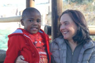 Anja Dalton (here with the sponsor child Ishmael)